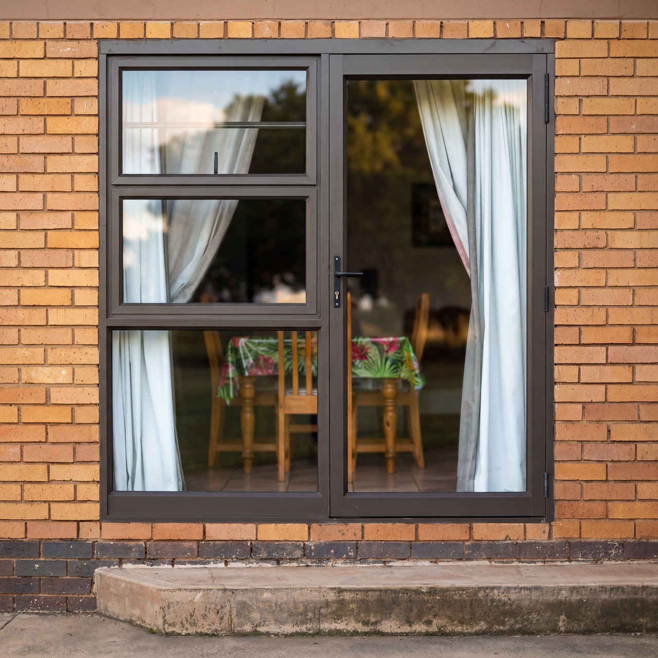 Architectural window detail with dark aluminium frame