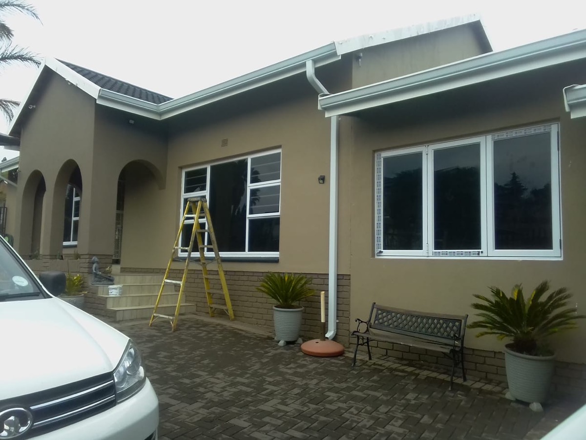 full-home white aluminium window installation, exterior view